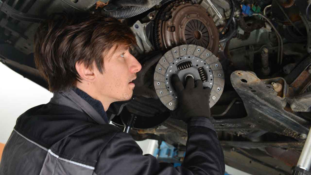 mechanic repairing the clutch